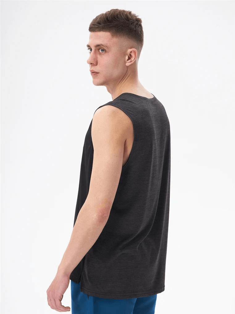 Man modeling a breathable double-color gym tank top with O-neck, made of lightweight polyester, ideal for workouts and keeping cool.